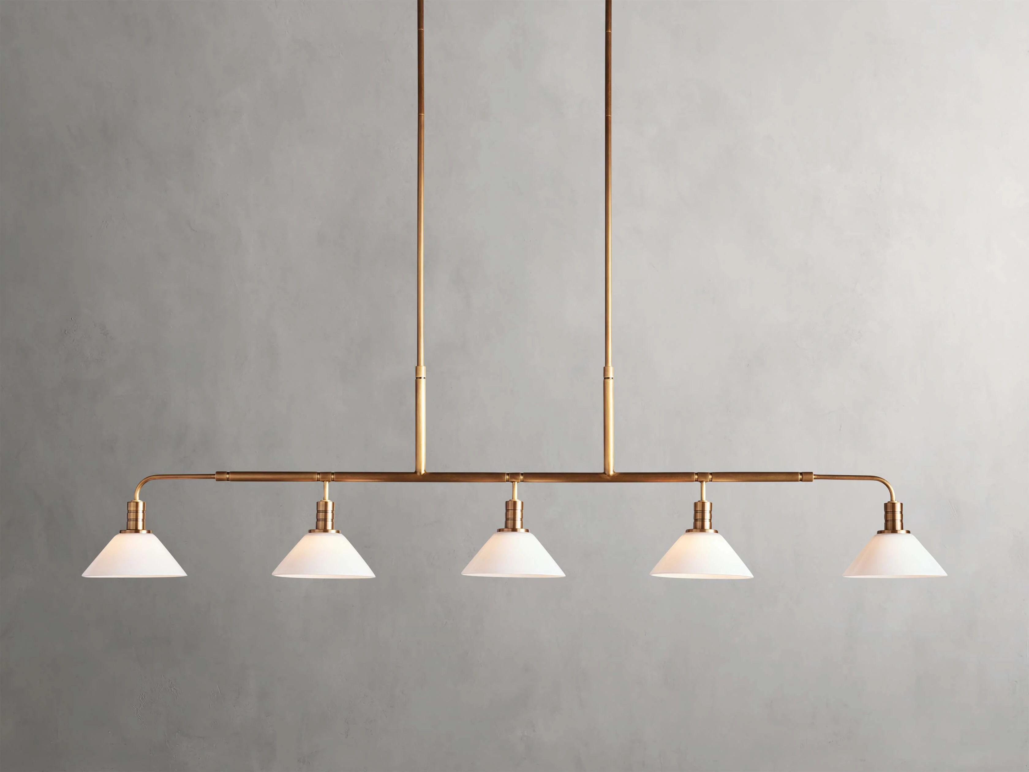 Theron 60" Linear Chandelier with Milk Glass in Brass